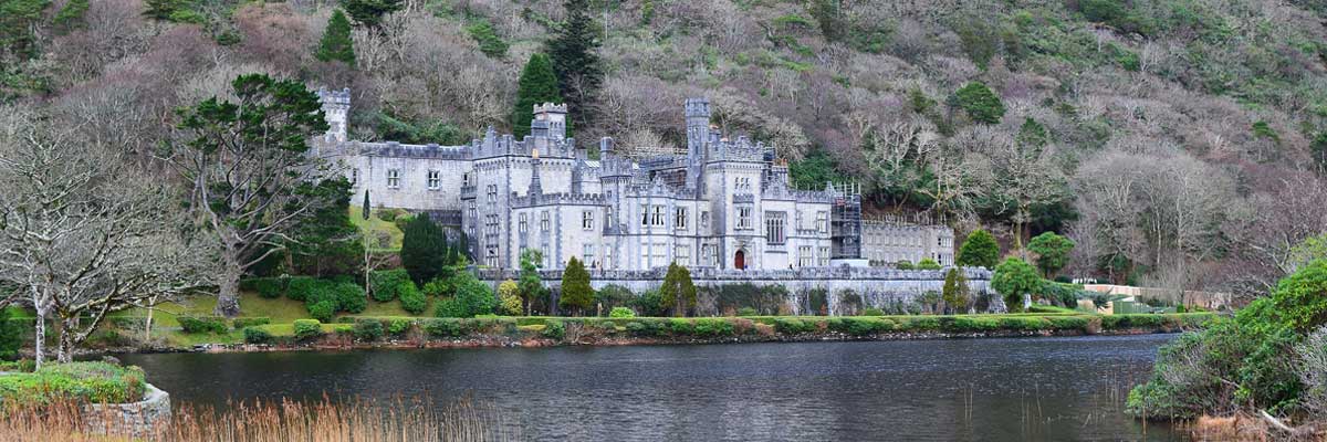 Ireland: A castle situated beside a river.